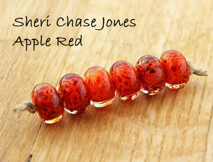 Apple Red over orange by Sheri Chase Jones