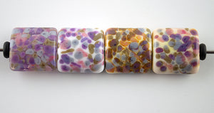 from left to right:  effetre clear, effetre white, effetre white with silver foil, effetre opal yellow