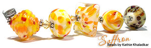Saffron frit blend by Glass Diversions - beads by Kathie Khaladkar